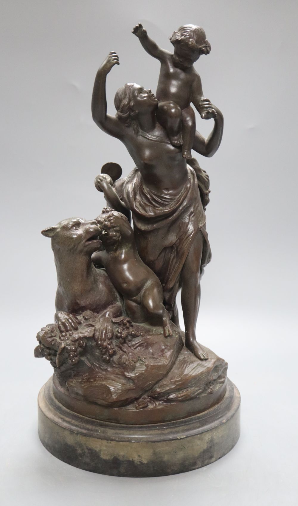 After Clodion. A bronze group of a mother, three putti and a panther, on naturalistic base and slate plinth, height 37.5cm